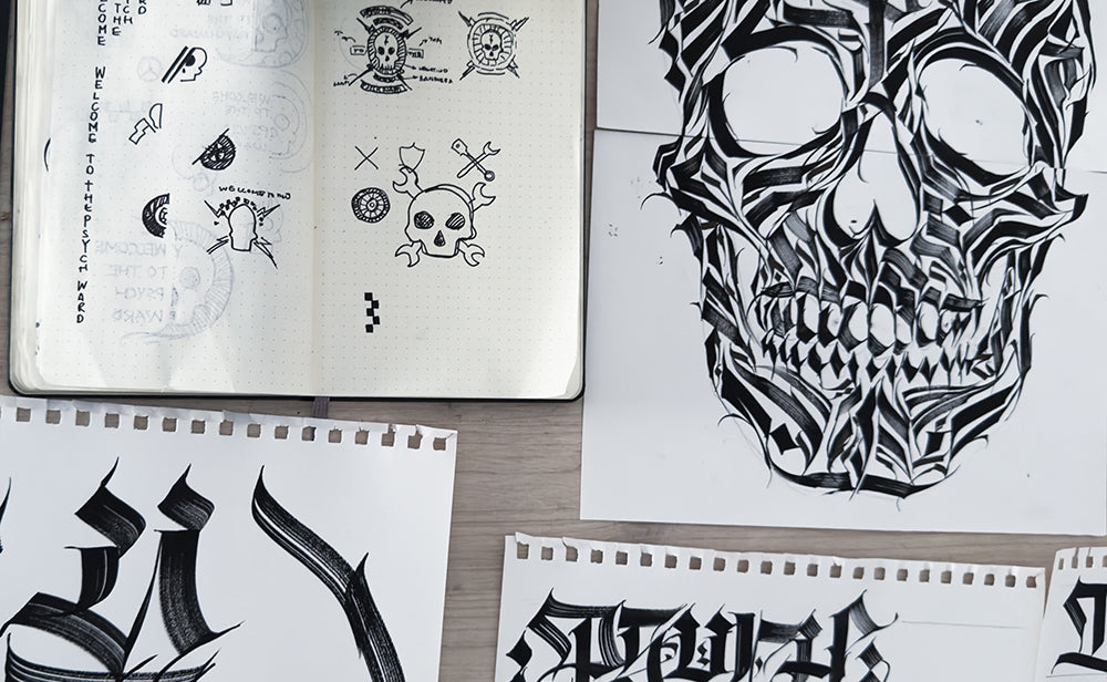 Collection of Young Psychos designs including a detailed skull on paper sheets.